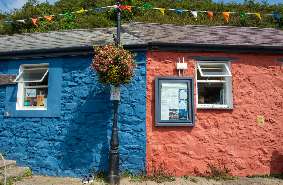 A blue-red old building in the port of Fishguard