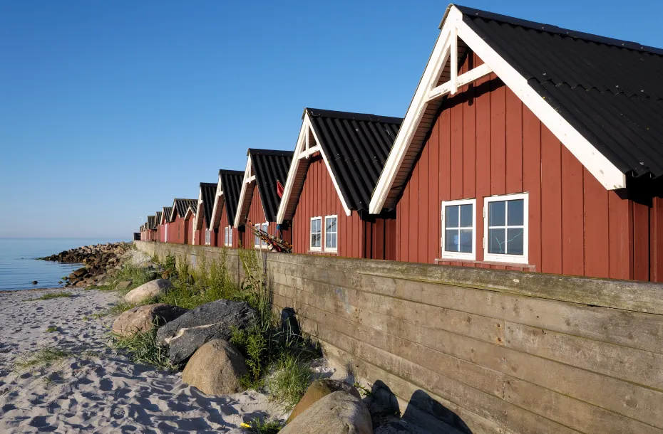 Orange houses in line in a beach in Frederikshavn