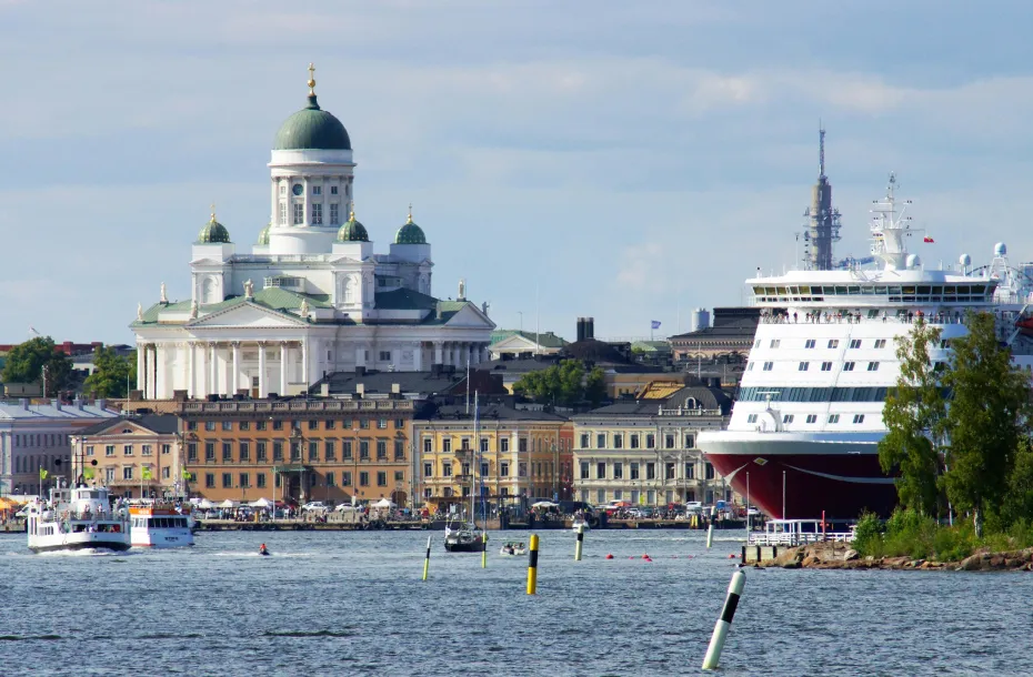 View of the town's dominating church and a conventional ship at the port of Helsinki