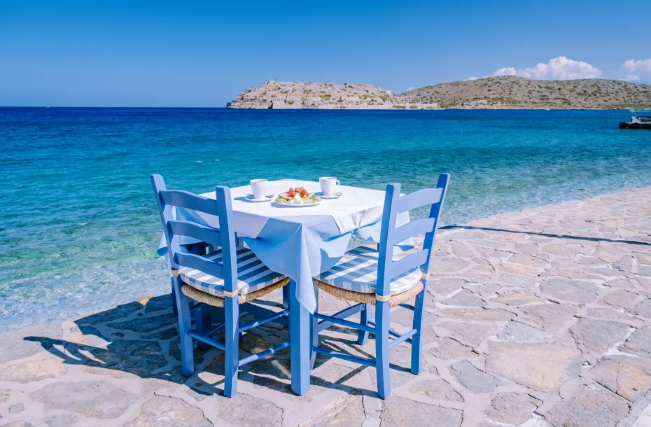 Tavern table next to the sea in Lasithi, Crete