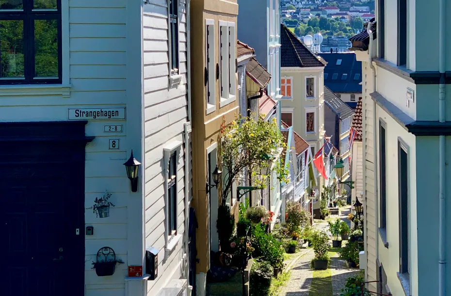 Beatiful narrow paved street in Bergen with buildings around