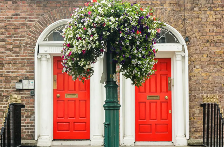 Two red doors of a building in a street in Dublin, Ireland