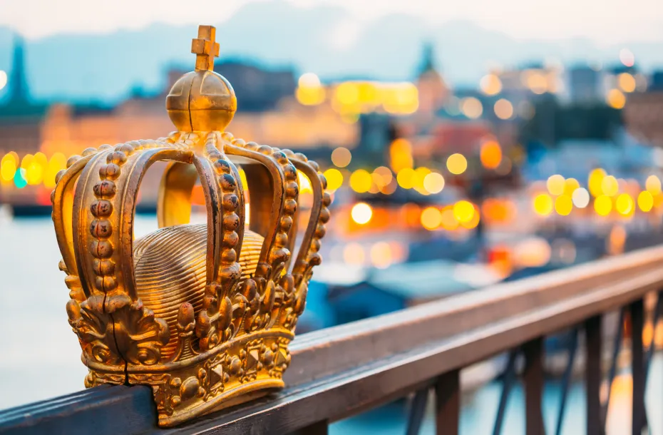 Skeppsholmsbron (Skeppsholm Bridge) in the background, with its famous Golden Crown in front, in Stockholm, Sweden