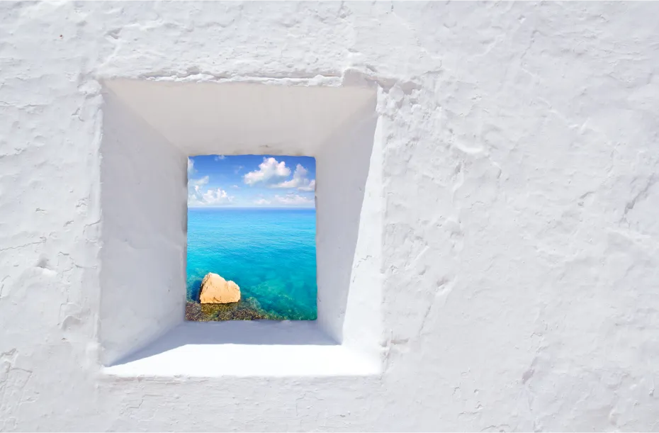 View to Formentera from a small window in Ibiza