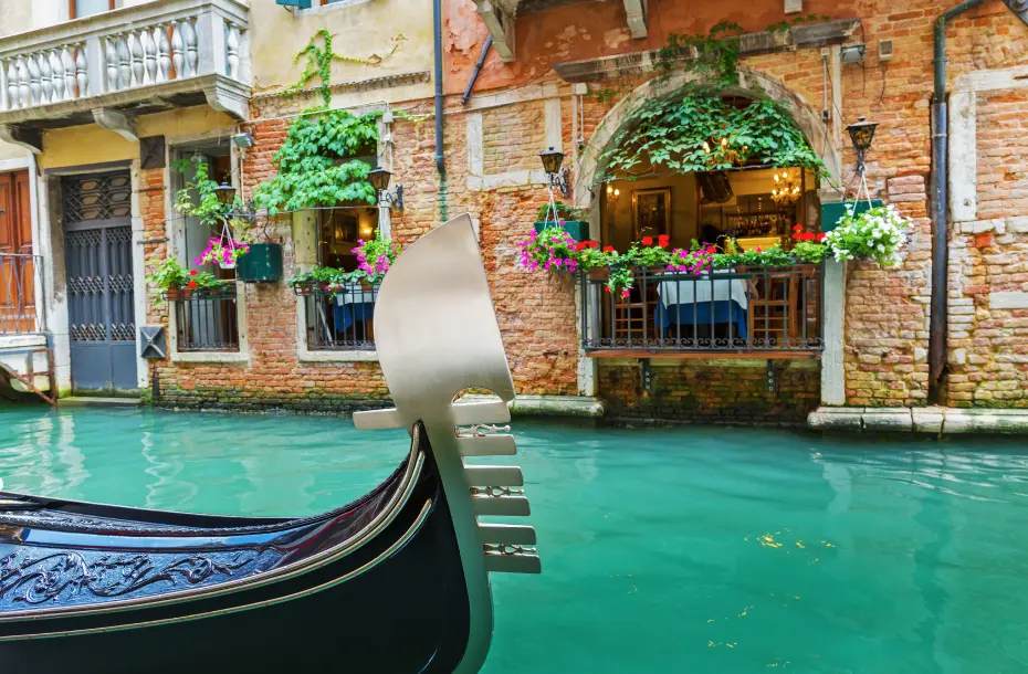 Charming cafe in the canals of Venice, Italy