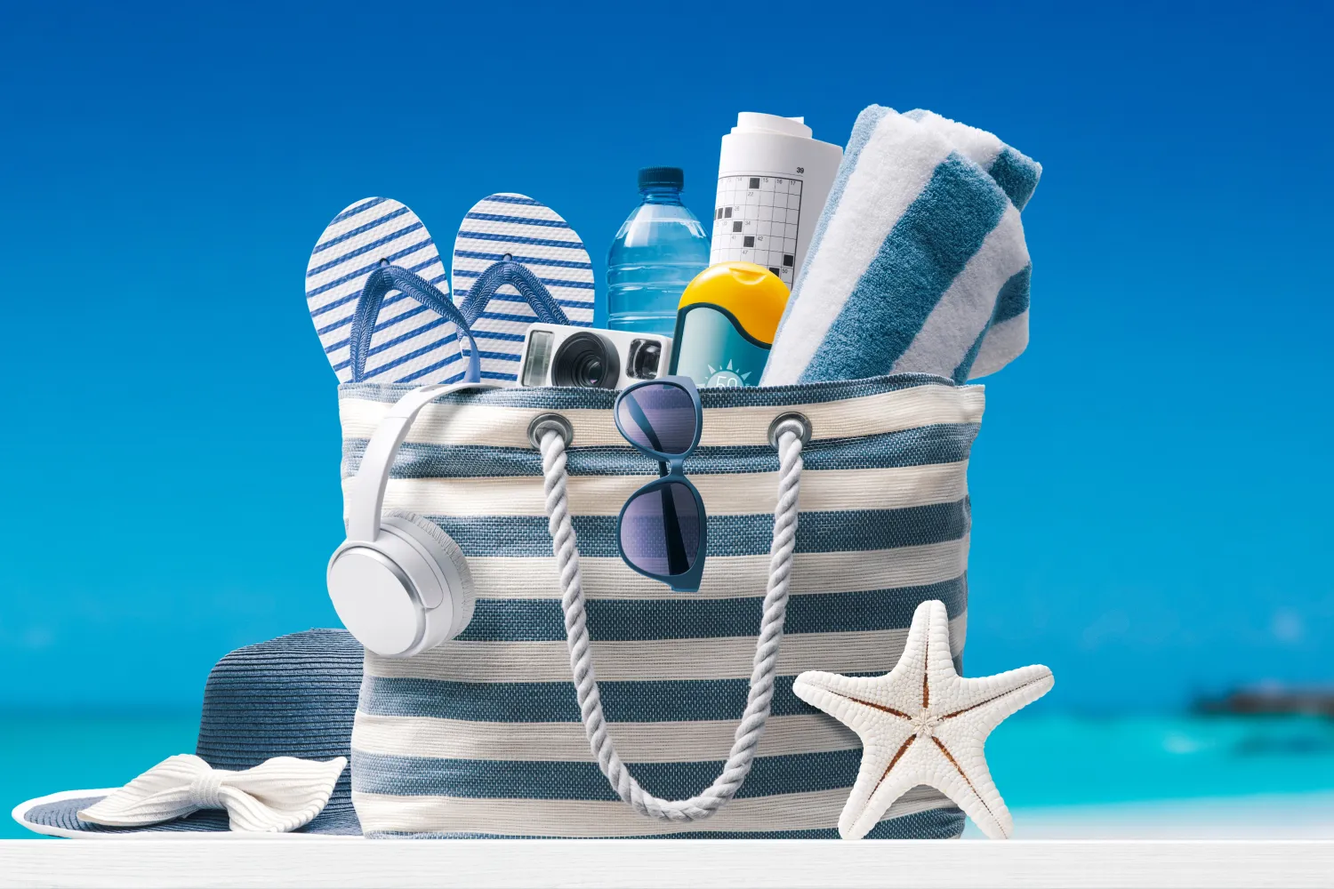Blue white stripped bag with beach accessories